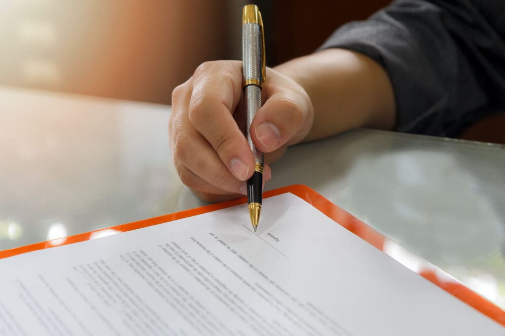 A buyer signing a personal guarantee for a lease contract.